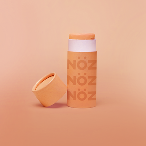 Nöz SPF sunscreen in a bright orange "Orange knows best" color