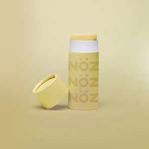 Nöz SPF sunscreen in a sun yellow "Sun of a Beach" color